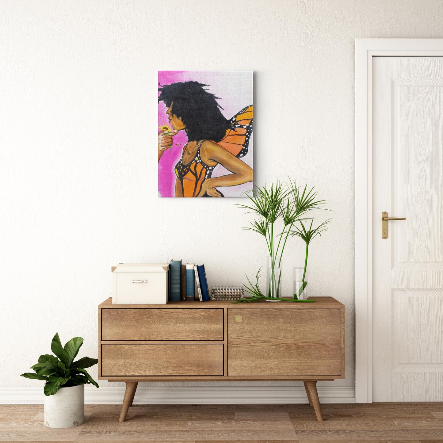 Surreal painting titled “Angelic Butterfly” showing a male hand holding a sunflower toward a Black woman depicted as a butterfly, symbolizing love and transformation.
