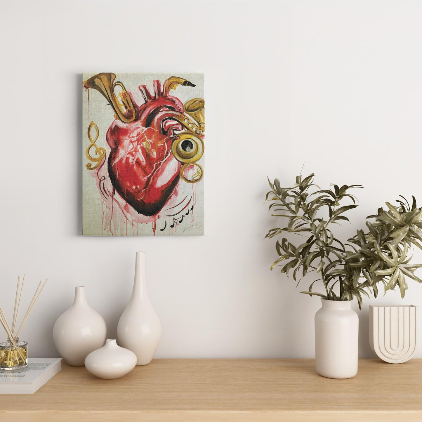 Abstract painting titled “From the Heart” showing musical instruments shaped like parts of a human heart—flutes, horns, and drums merging in surreal form.