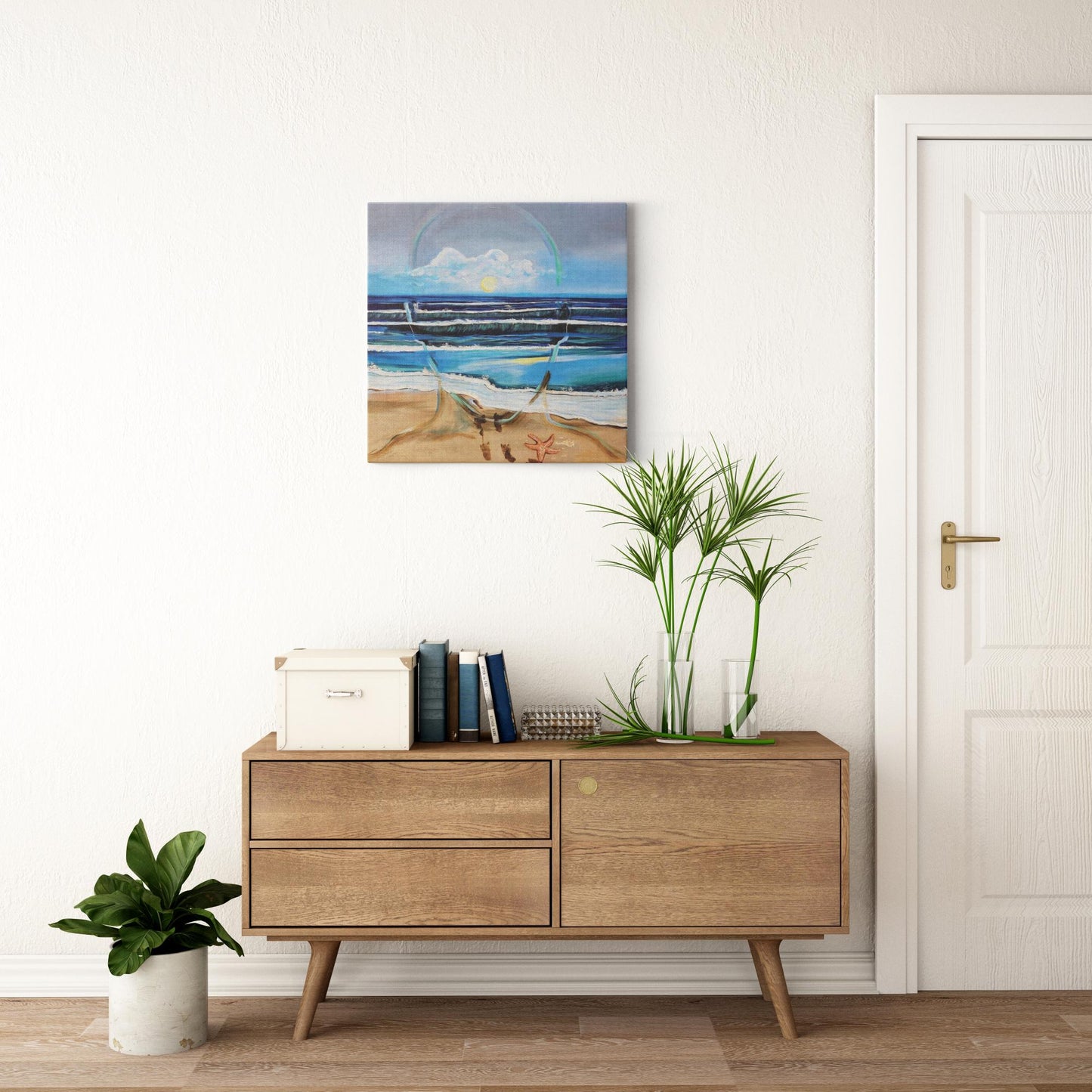 Painting titled “Fluent” showing an ocean scene blending with the outline of a male face, waves running into sand, starfish and shells, with a glowing sun symbolizing peace and focus.