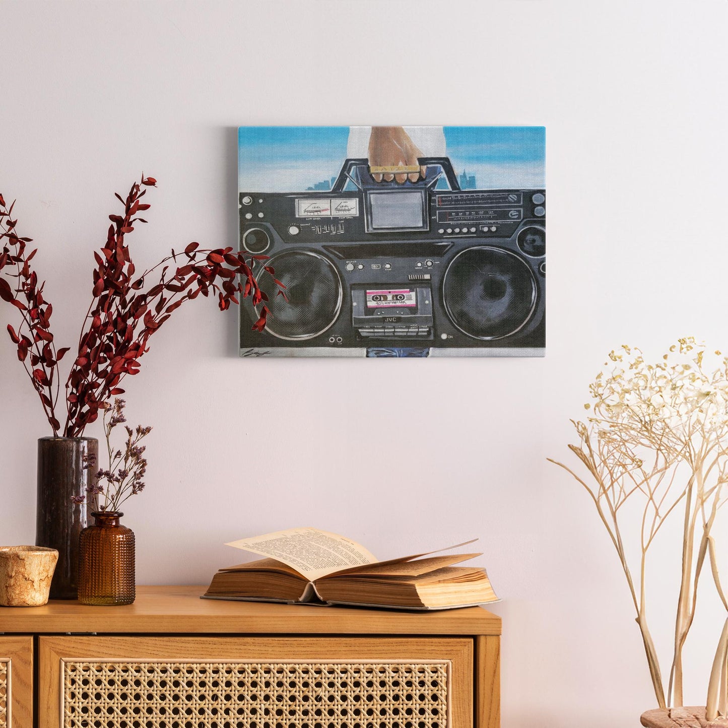 Painting titled “My Boom Box” showing a man in a white T-shirt holding a boombox with a BAIZE ring on his fingers and a faint city skyline in the background.