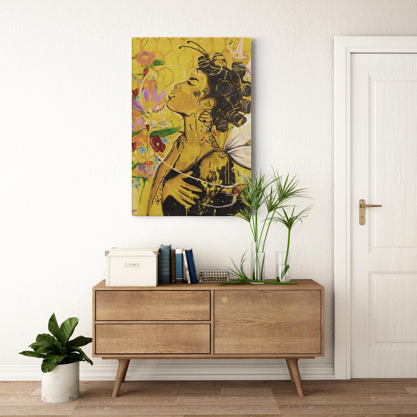 Painting titled “Angelic Butterfly” showing a Black woman with bantu knots, honey-dipped skin, butterfly wings, gold flakes, and bees in a bright yellow setting.